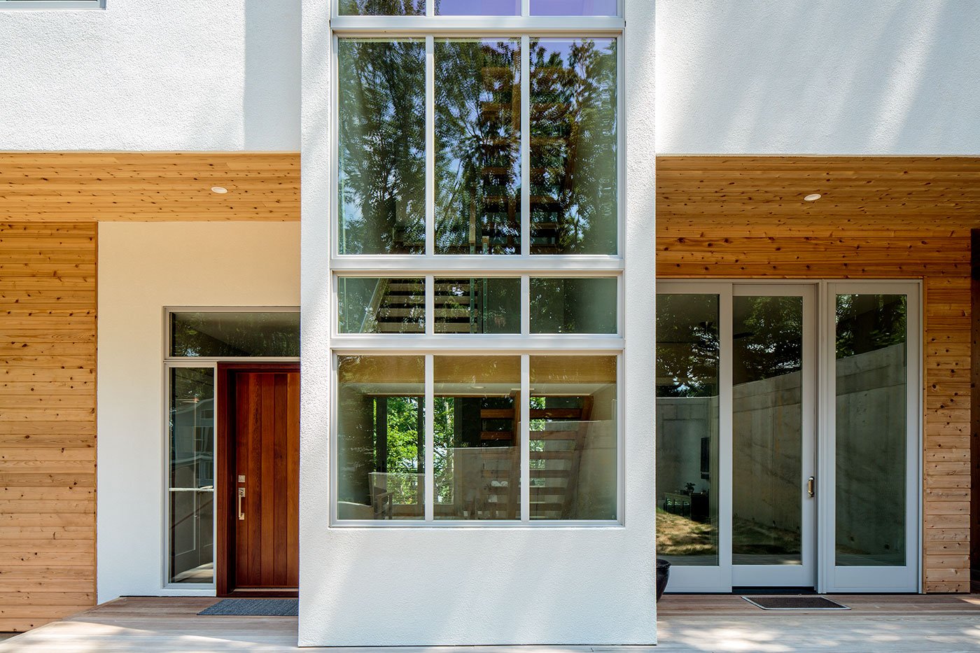 A modern home with large expanses of glass.